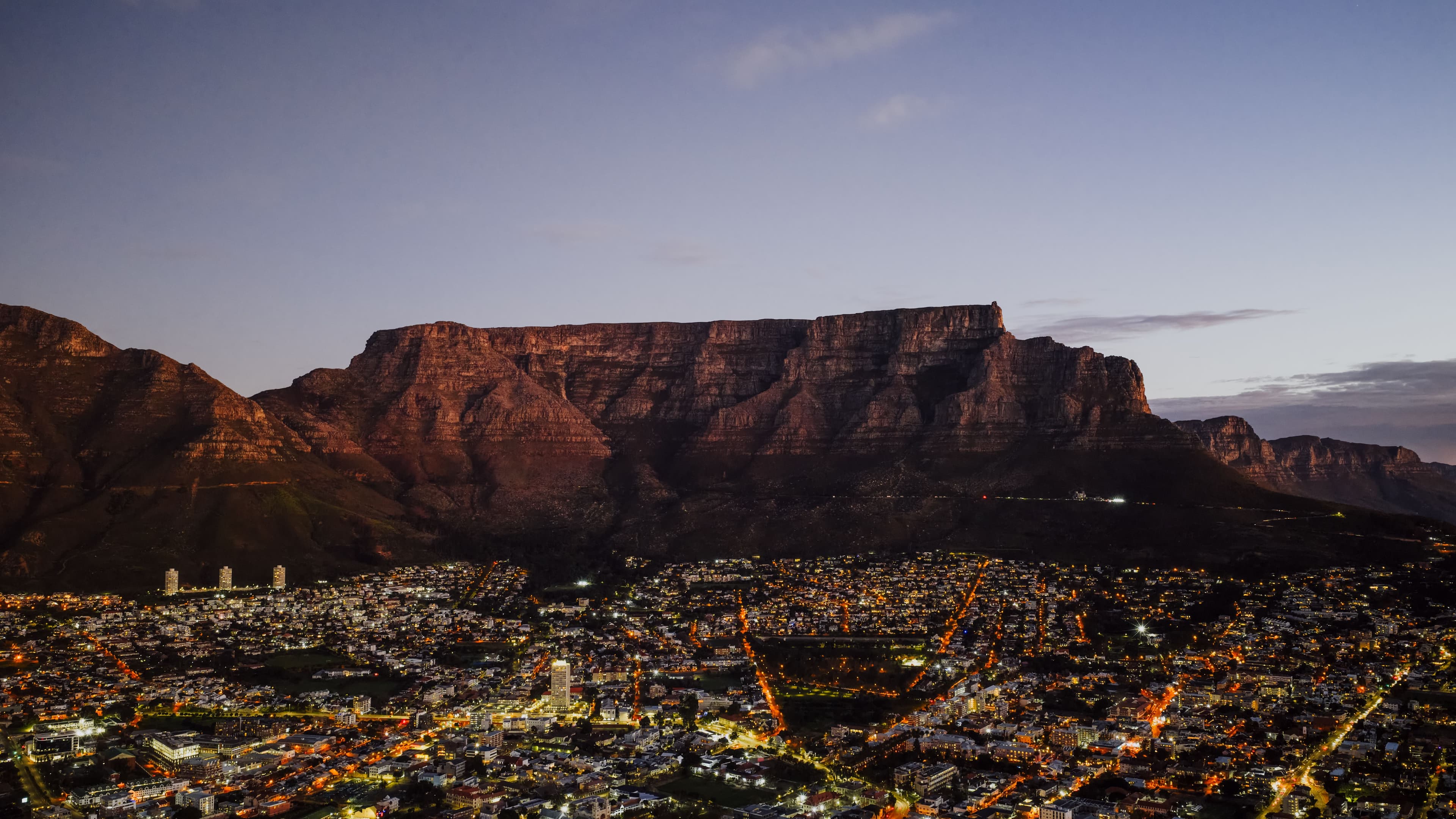 Aerial views cycling between the Winelands, Cape Town coastline, and safari savanna